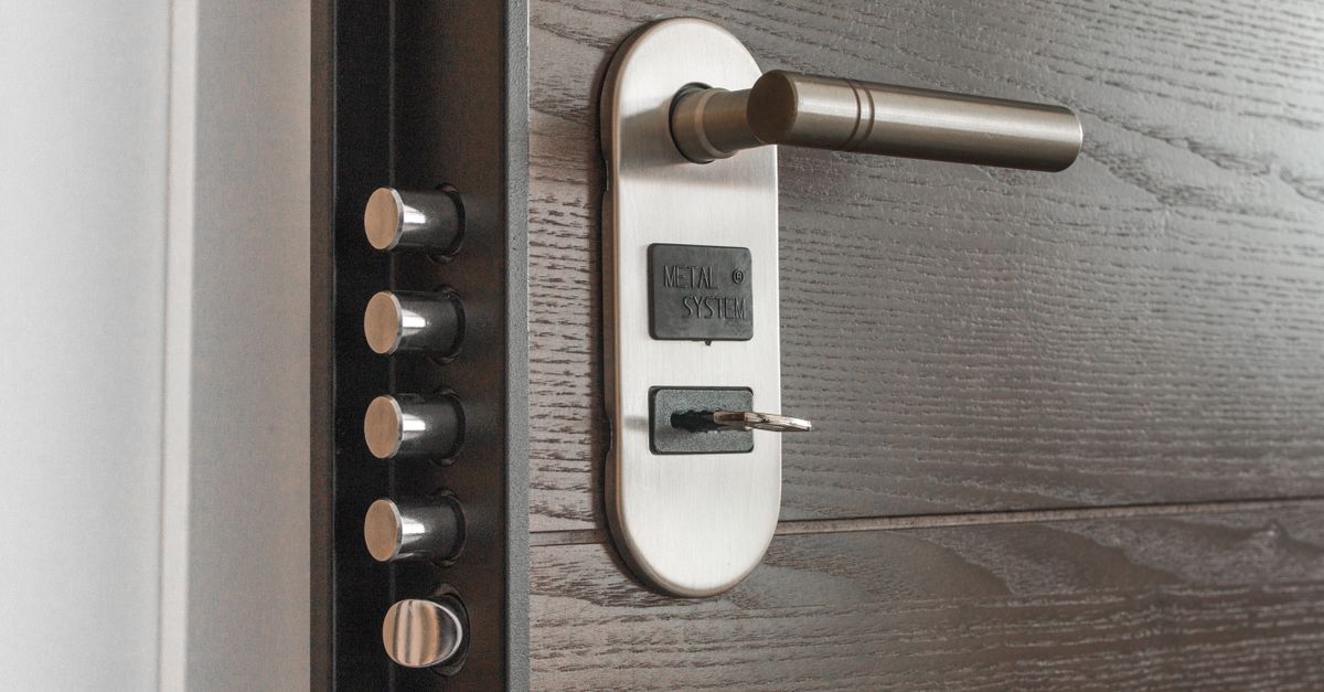 locksmith unlocking front door — Anytime Locksmith